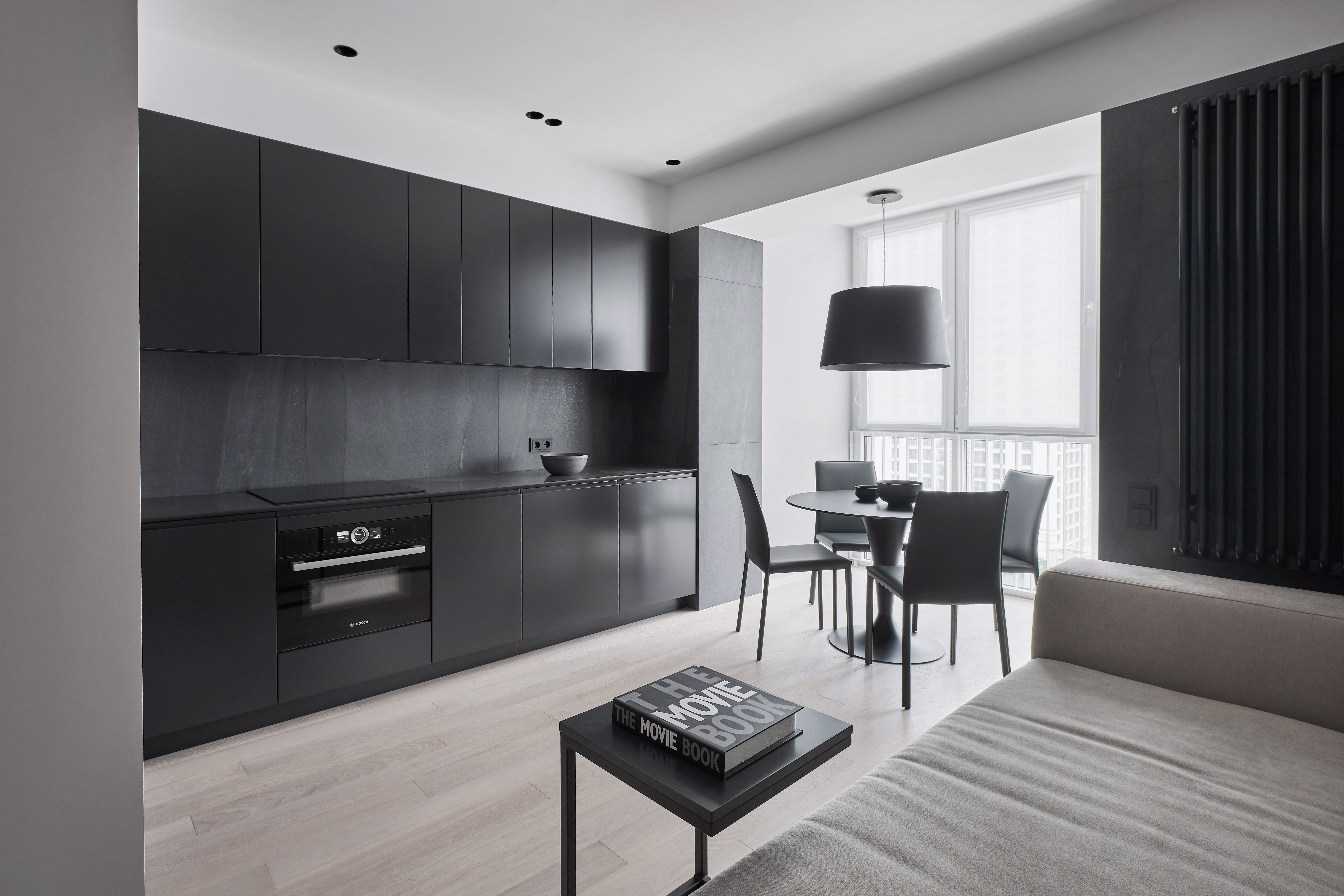 Modern kitchen with dark cabinetry and refined finishes